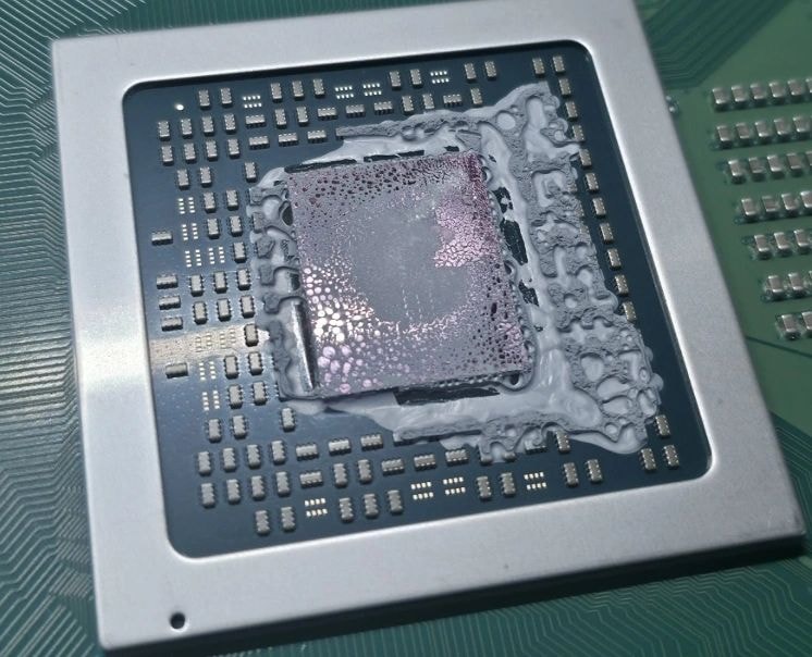 CPU thermal paste application on motherboard